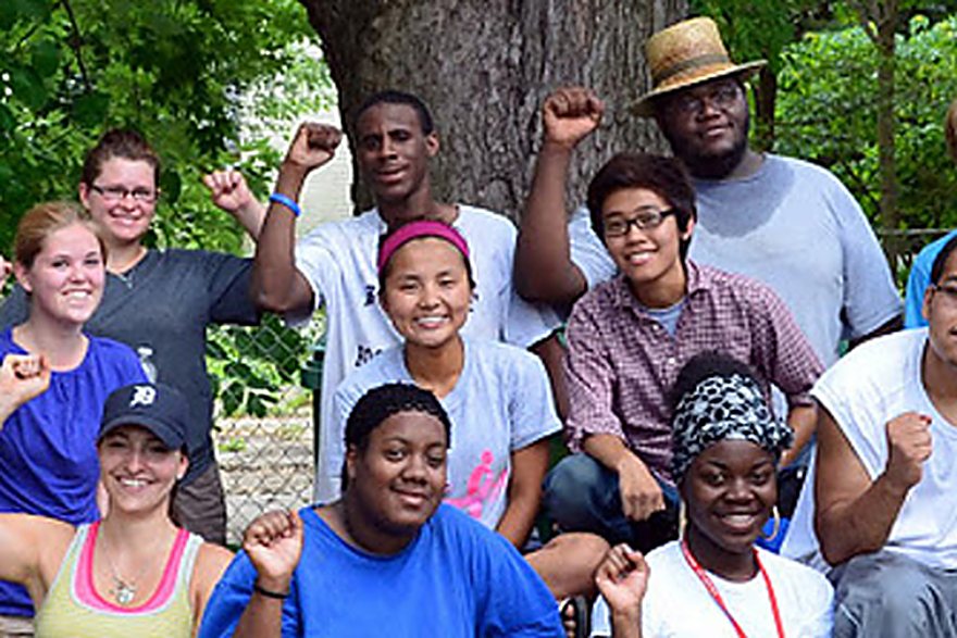 Growers and volunteers from the farm, gathered under a tree